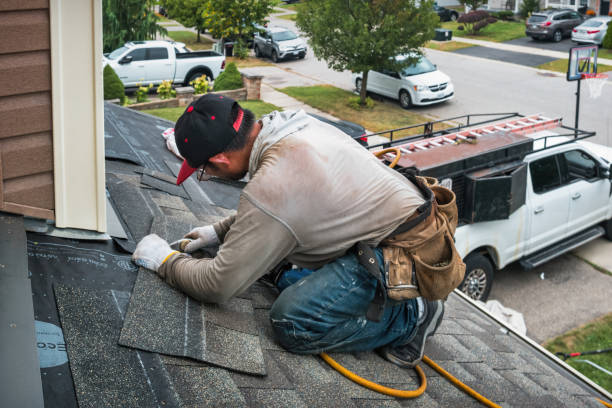 Professional Roofing technician working in Locke, NY